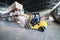 Forklift transporting loads inside the industrial warehouse.