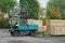 Forklift transports the boards at the plant for woodworking