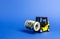 Forklift truck carries a bundle of dollars. Attracting direct investment in business and production, improving economic