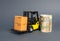 A forklift truck carries cardboard boxes and Euro roll. Transport company. Performance efficient. Trade and production of products