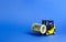 Forklift truck carries a money roll of Euros. Export of capital. Attracting direct investment in business and production