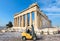 Forklift truck drives by Parthenon temple on Acropolis of Athens, Greece