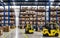 Forklift-truck loading packed goods in huge distribution warehouse with high shelves. warehouse space. warehouse interior with