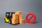 Forklift truck near cardboard boxes and a red symbol NO. Embargo, trade wars. Restriction on the importation of goods, proprietary