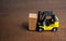 A forklift truck transports a wooden crate box. Trading transportation services. Import export. Warehousing. Tracking deliveries.