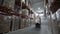 Forklift Trucks load Pallets with Cardboard Boxes at modern warehouse