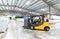 Forklift trucks transported in a warehouse - storage of goods in