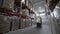 Forklift Trucks unload Pallets with Cardboard Boxes at modern warehouse