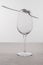 Forks on empty wine glass on tablecloth isolated on grey