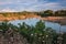 Forlimpopoli, Forli-Cesena, Emilia Romagna, Italy: landscape with a pond and the hill town Bertinoro on background