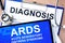 Form with diagnosis and tablet with acute respiratory distress syndrome ARDS