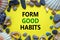Form good habits symbol. Words `Form good habits` on a beautiful yellow background. Sea stones and seashells. Business, psycholo