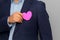 Formal latin man with blue jacket and red heart in his pocket. Valentine`s Day