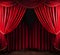 A formal red stage curtain featuring an arched entrance enhances the aesthetic appeal of the theatrical performance.