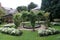 Formal sunken garden with a summerhouse, lily pond & rose arch