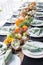 Formal Thanksgiving table in the fall family group get together on chavari chairs white plates crystal silverware pastel green