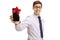 Formally dressed guy showing phone wrapped with ribbon as gift