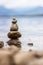 Formation of balanced rocks situated on a beach near a body of water