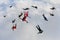 Formation skydiving. A group of skydivers is in the winter season.