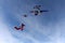 Formation skydiving. Skydivers are jumping out of a plane.