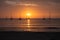 FormenteraÂ´s beach during a sunset with yachts mooring close by the island