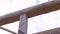 Forming the wooden frame of eco friendly new building on cloudy sky background. Clip. Bottom view of a log being