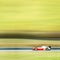 Formula one race car on speed track - motion blur background wit