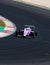 Formula single seater sport racing pink car action on asphalt track turn