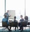 Formulating ideas. a group of coworkers sitting in on a presentation in a boardroom.