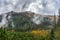 Forrest with mountains covered in clouds. High Tatra mountains