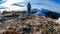 Forstalpe - Woman with hiking backpack walking on snow covered alpine meadow on trail from Ladinger Spitz