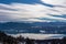 Forstsee - Panoramic view of the lake Woerthersee (lake Worth), tower Pyramidenkogel and snow capped Karawanks