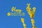 Forsythia golden decoration early spring easter bush with blue sky and happy easter sign