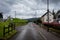 FORT AUGUSTUS, SCOTLAND, DECEMBER 17, 2018: View of the road aside the Caledonian Canal while a bird flies on a cloudy day. A