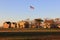 Fort Hancock parade grounds, Command Quarters buildings and flagstaff, view at sunset, Sandy Hook, NJ