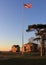 Fort Hancock parade grounds, Command Quarters buildings and flagstaff, view at sunset, Sandy Hook, NJ