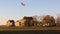 Fort Hancock parade grounds, Command Quarters buildings and flagstaff, view at sunset, Sandy Hook, NJ