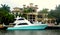Fort Lauderdale, Florida, U.S.A - January 3, 2020 - A luxury waterfront mansion with a boat by the bay