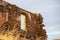 Fort ruins at Tzia, Kea island, Greece. Red stonewall of ancient castle background