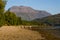 FORT WILLIAM, SCOTLAND - SEPTEMBER 01 2021: Ben Nevis mountain viewed from the shores of Loch Eil in the evening sunshine at the