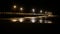 Forte dei Marmi: Pier in rough seas at night, street lights on