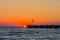 Forte dei marmi's pier at sunset, people watching the sun in