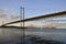 Forth Road Bridge with the Forth Bridge in the background at dusk.