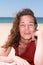 Forties smiling woman at the beach