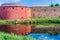 Fortification walls of Malmo Castle reflecting in its moat, Swed