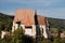 Fortified church with defence wall and tower