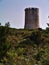 Fortified cylindrical stone watchtower.