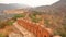 Fortified walls with Amber fort in the background, Amber, Rajasthan, India