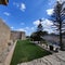 Fortress of Mdina with huge bastions and ornamental garden in moat, Malta