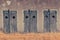 Fortress wall with wooden doors with bars